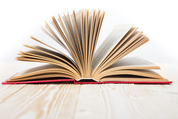 Open book on wooden table. Back to school. Copy space