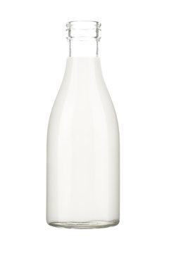 Old milk glass bottle with milk on white background.