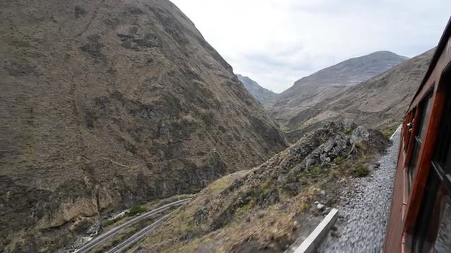Train passing through a canyon near Alausi, Ecuador