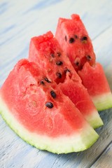 Three fresh slices of red melon