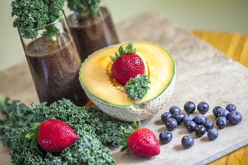 Healthy smoothie with berry fruit,cantaloupe and green kale.