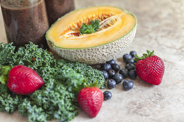 Healthy smoothie with berry fruit,cantaloupe and green kale.