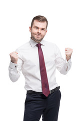 Closeup portrait of happy successful student, business man winning, fists pumped celebrating success. Isolated.