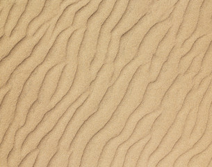 Close-up of sand on a beach in the summer time.