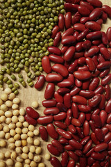 beans and a wooden spoon on the old wood table
