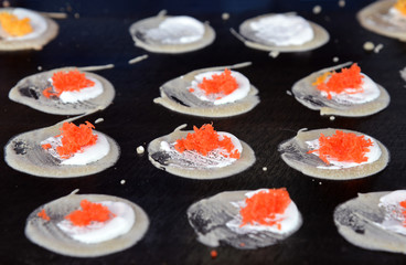 Khanom Beaung Thai or a kind of filled pancake Thai food or Thai Style Crisp Tart on hot pan.