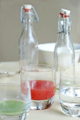 Watermelon juice in glass bottle on table