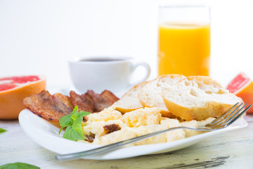 Scrambled eggs with bacon, breakfast