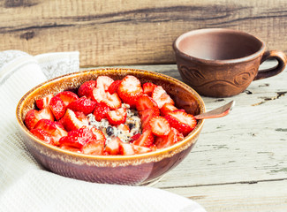 oatmeal with poppy seeds, raisins and berries, healthy breakfast