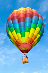 Fototapeta premium Hot air balloon over blue sky