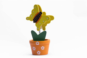 Paper Clip A wooden flower pot and butterfly.