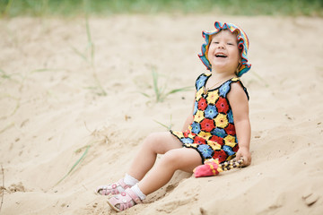 little girl with bright colorful dress