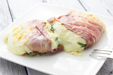Tomino cheese with bacon