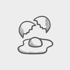 Broken egg with yolk sketch icon