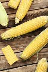 Corns on a brown wooden background