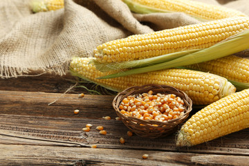 Corns on a brown wooden background