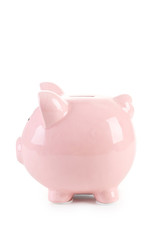 Pink piggy bank isolated on a white
