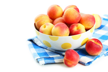 Fresh apricots in bowl on a white background
