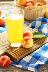 Apricot juice on a grey wooden background