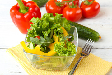fresh vegetable salad in bowl on table close up