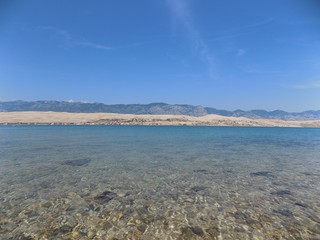 Sea, mountains and blue sky