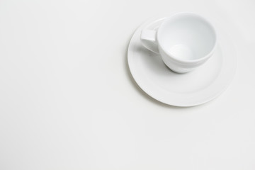 White empty coffee cup on white background. View top