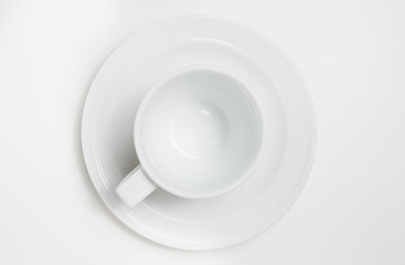White empty coffee cup on white background. View top