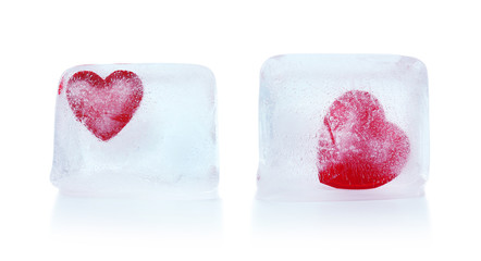 Obraz na płótnie Canvas Red hearts in ice cubes isolated on white