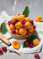 Fresh ripe apricots and raspberry