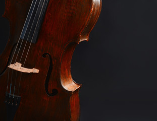 Vintage cello on dark background