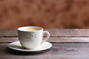 Cup of coffee on blurred background