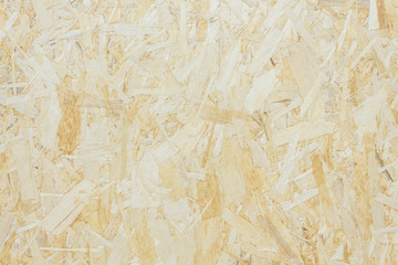 Surface made of pressed wooden shavings as an abstract background, textured background.