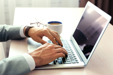 Man working with laptop in office