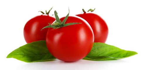 Cherry tomatoes with basil isolated on white