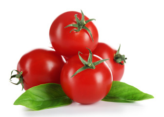 Cherry tomatoes with basil isolated on white
