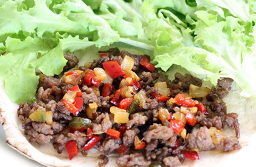 healthy eating: grilled beef taco with vegetables, salad served on plate
