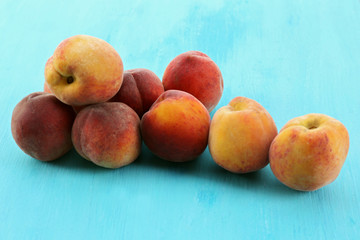 Sweet ripe peaches on table close up