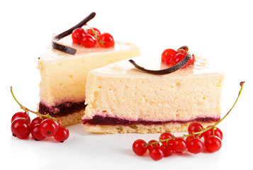 Tasty pieces of cheesecake with berries isolated on white