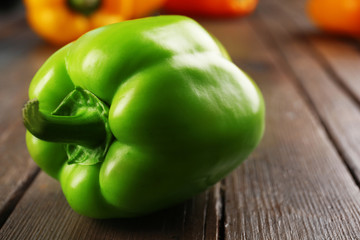 Colorful peppers on rustic wooden table, closeup