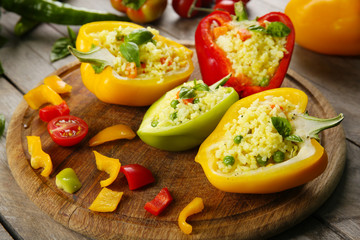 Stuffed peppers with vegetables on table close up