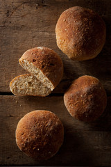 loaf of fresh bread on wooden background