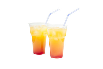 Lemonade with ice and a tubule in a plastic glass