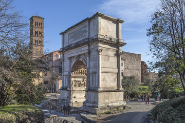 Fototapeta na wymiar Triumphal Arch of the Emperor Titus on Roman forum in Rome, Italy