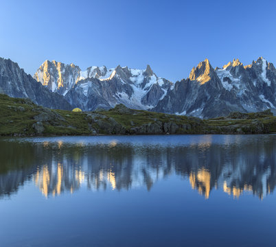 Grandes Jorasses and Dent du Geant reflected at sunrise in Lac des Cheserys, Haute Savoie, French Alps, France 