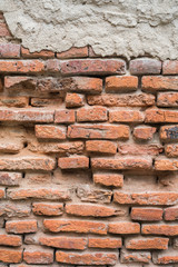 Old red brick wall in the wall of old building.