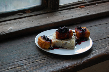 vegetarian dinner with breaded Camembert cheese, blueberry jam and rice