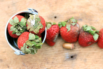 Strawberry rotten on wood vintage