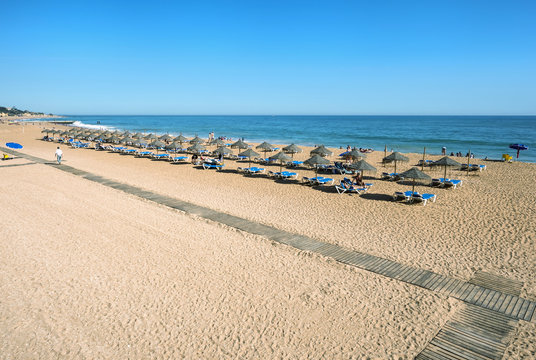 Umbrellas and beach chairs, Fisherman's Beach (Praia dos Barcos), Albufeira, Algarve, Portugal