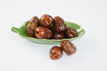Dried preserved. Sweet syrup monkey apple or Chinese date on bac