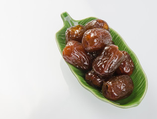 Dried preserved. Sweet syrup monkey apple or Chinese date on bac